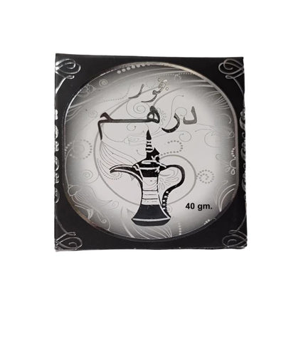 Bukhoor Dirham by Ard Al Zaafaran, a premium 40g Arabian incense featuring a captivating OUD fragrance, displayed in an elegant silver and black packaging with a traditional Arabian design.