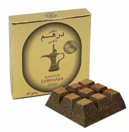 Bukhoor Dirham Gold by Ard Al Zaafaran, a luxurious 40g Arabian incense with rich oudh fragrance, displayed with its elegant gold packaging and shaped pieces.