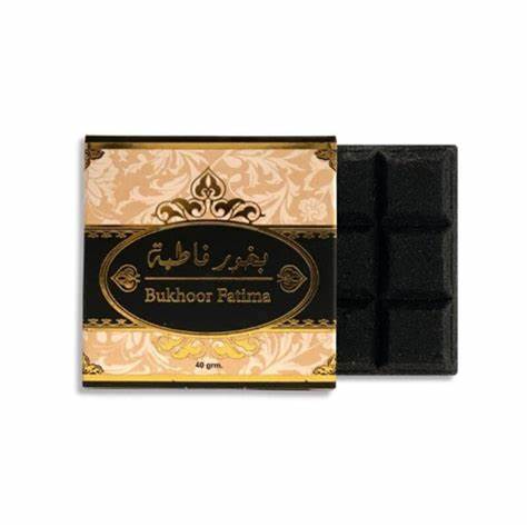 Bukhoor Fatima by Ard Al Zaafaran, a premium 40g Arabian incense with rich oud fragrance, displayed in its elegant black and gold packaging.