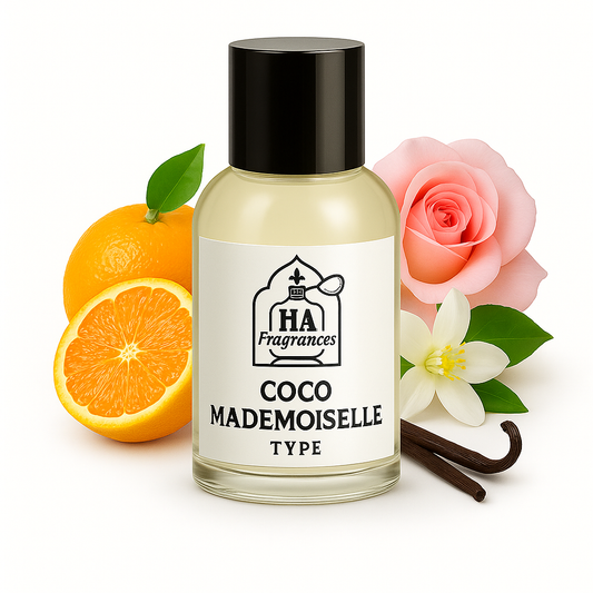 Coco Mademoiselle Type perfume oil by HA Fragrances in a glass bottle, surrounded by orange slices, pink rose, white orange blossom, and vanilla bean on a white background.