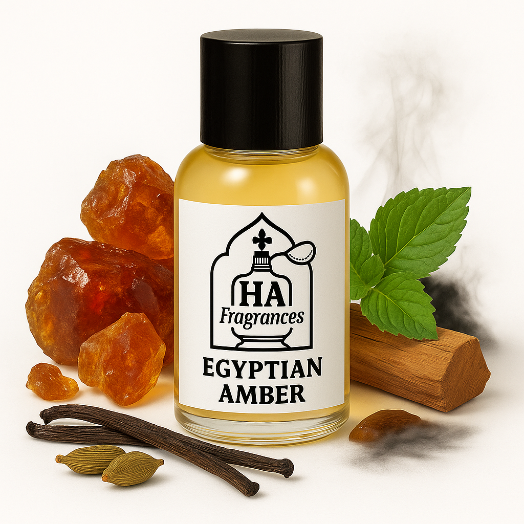 Egyptian Amber Inspired perfume oil by HA Fragrances in a clear glass bottle, surrounded by amber resin, sandalwood, patchouli leaves, and warm golden tones on a white background.