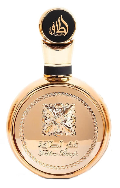 Fakhar Extrait Gold Eau De Parfum by Lattafa, showcasing a stunning round gold bottle adorned with a floral and rope-like motif for an elegant touch.