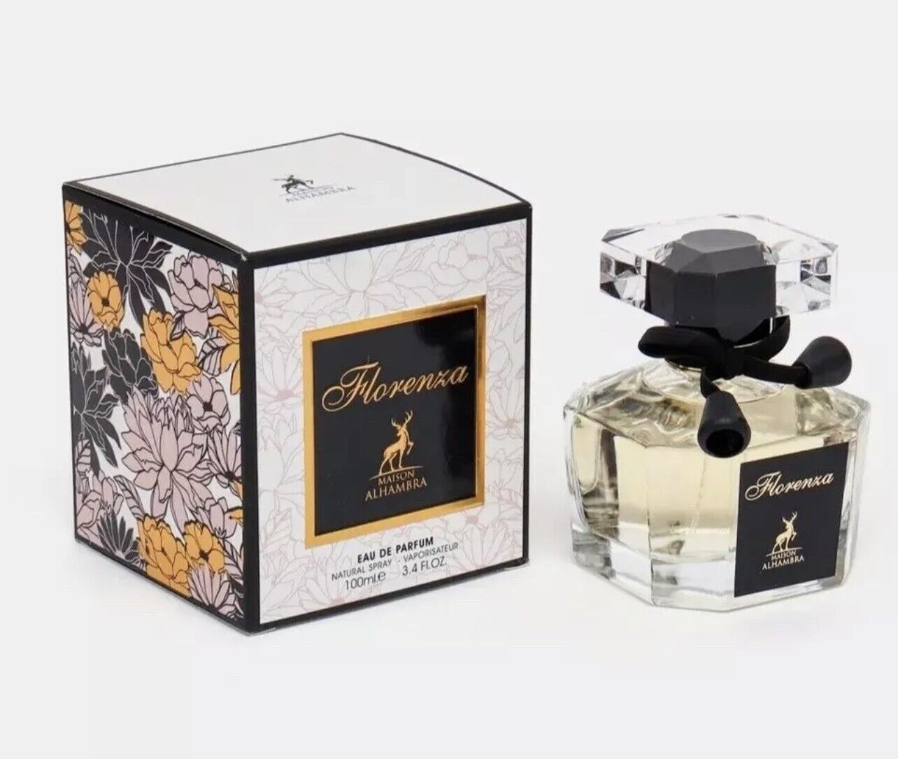 Florence Eau De Parfum 3.4oz by Maison Alhambra, featuring an elegant crystal bottle adorned with a black bow and luxurious floral-themed packaging, representing a sophisticated blend of floral and woody notes.