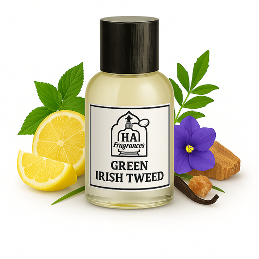 Green Irish Tweed Type cologne oil by HA Fragrances in a clear glass bottle, surrounded by lemon slices, violet flower, verbena leaves, sandalwood, and amber resin on a white background.