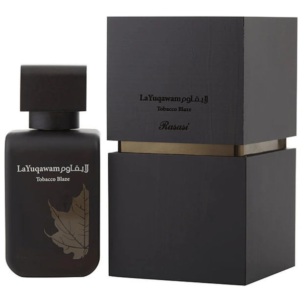 La Yuqawam Tobacco Blaze by Rasasi, featuring a sleek black bottle with gold accents and matching elegant box packaging.