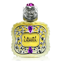 Close-up of Lamya CPO by Nabeel, featuring an elegant golden fragrance bottle adorned with silver detailing and striking purple gemstone accents.
