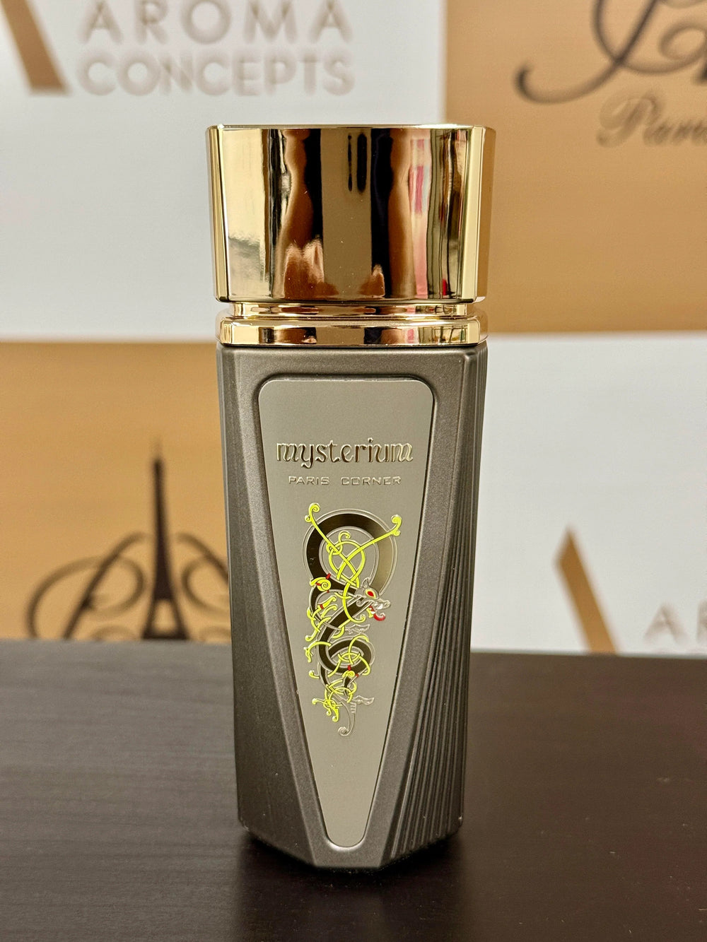 Close-up of Mysterium Eau de Parfum by Paris Corner – unisex citrus summer fragrance in a sleek metallic bottle with gold cap.