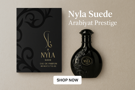 Promotional banner for Nyla Suede by Arabiyat Prestige featuring the elegant black bottle and luxury packaging with a Shop Now button