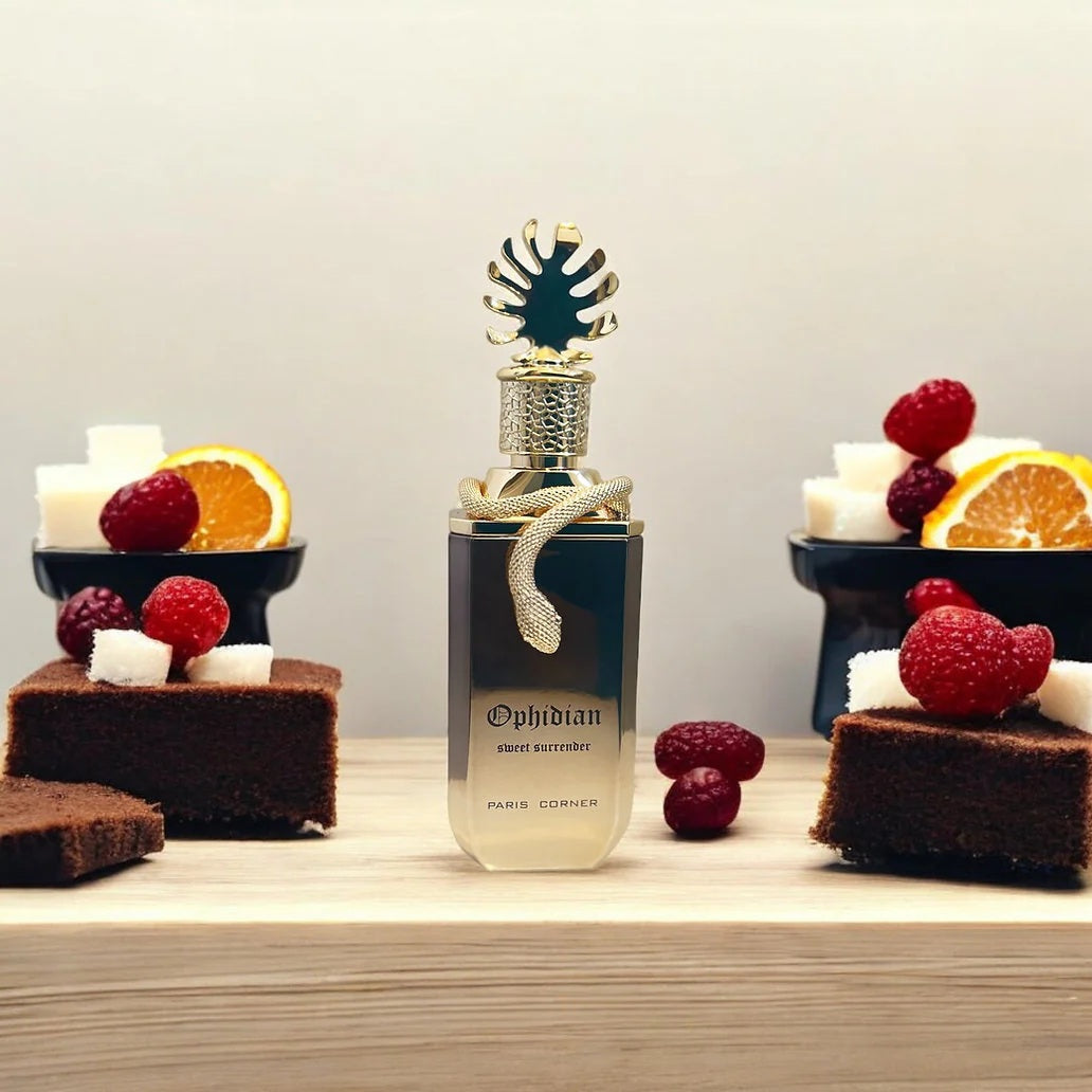 Ophidian Sweet Surrender Perfume by Paris Corner 100ml EDP bottle displayed with sugar cubes, raspberries, chocolate cake, and orange slices – a decadent unisex gourmand fragrance

