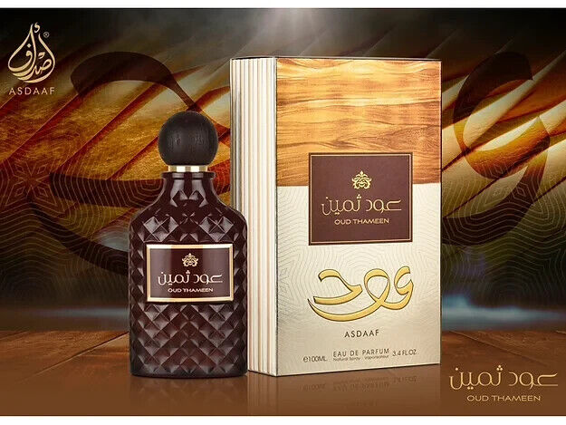 Oud Thameen EDP Perfume by Asdaaf Lattafa, featuring a luxurious dark glass bottle with a textured design and its elegant packaging in a 100 ML presentation.