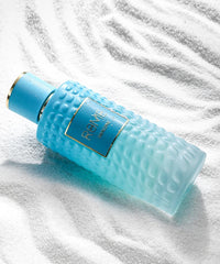 Rome Imagine Eau de Parfum by Bharara Beauty – blue embossed bottle on white textured surface, representing fresh citrus and aquatic unisex fragrance