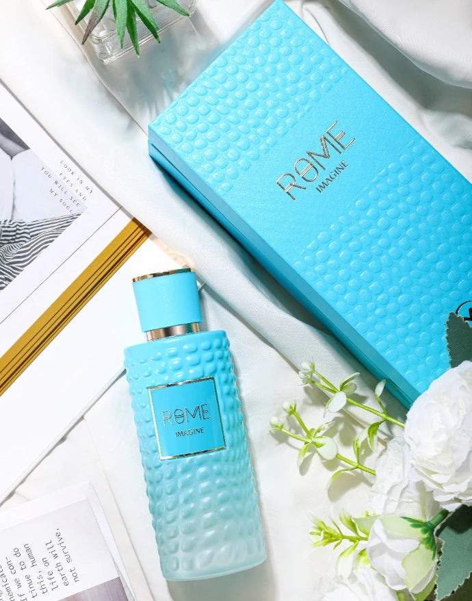 Bharara Beauty Rome Imagine EDP – full product display with turquoise bottle and matching box, styled with florals and lifestyle props