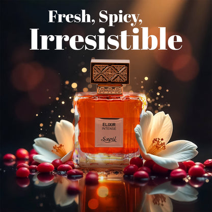 Elixir Intense by Sapil perfume bottle surrounded by flowers and red berries with text “Fresh, Spicy, Irresistible