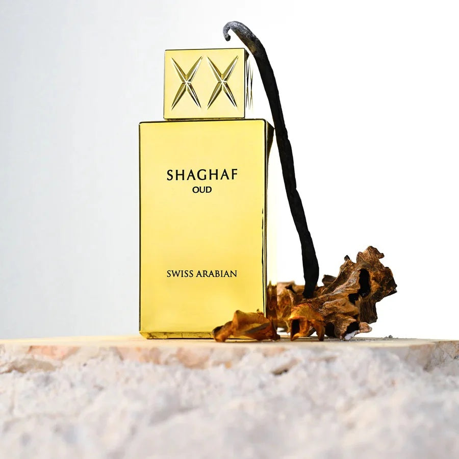 Shaghaf Oud by Swiss Arabian perfume bottle artistically displayed with oud and vanilla, highlighting its oriental and gourmand fragrance notes.