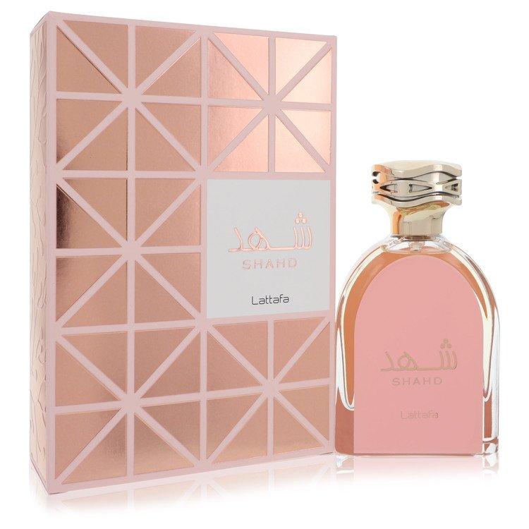 Shahd Eau de Parfum by Lattafa, showcasing a luxurious pink and gold bottle alongside its modern geometric pink packaging, 100ML unisex perfume.