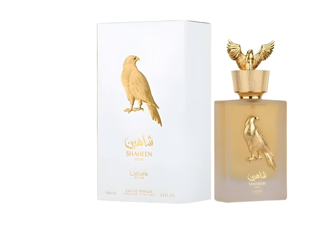 Shaheen Gold Eau de Parfum by Lattafa Pride, showcasing a luxurious gold bottle with its matching white and gold packaging, 100ML fragrance.